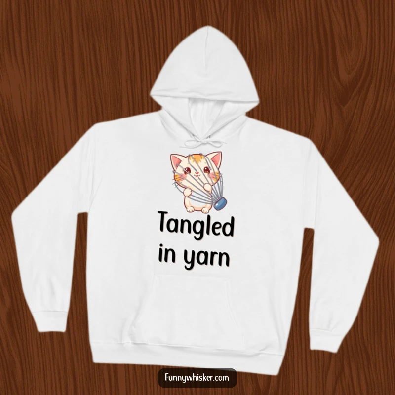 Funny hoodie with a small cat hiding behind a large, shaking whisk, offering warmth and humor for cat lovers.
