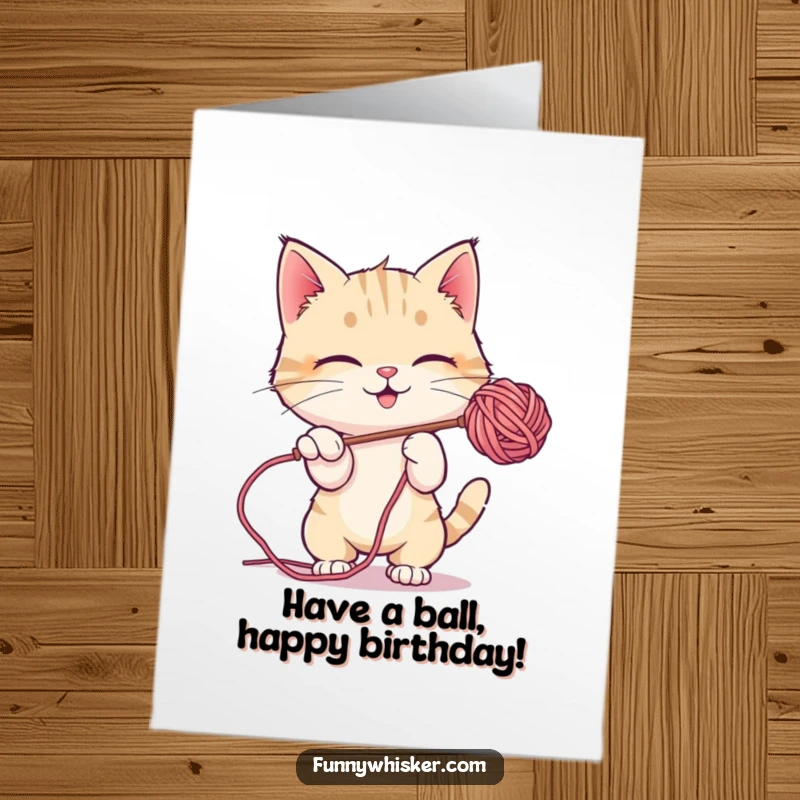 Funny Free Printable Birthday Card: A playful cat character joyfully bats at a colorful, floating ball of fuzzy yarn, caught in the moment.